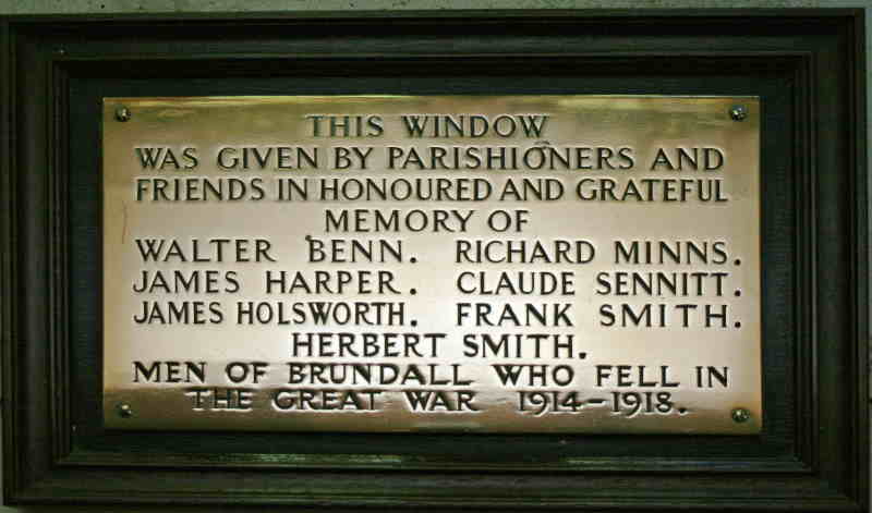 The plaque below the memorial window at Brundall Church to those who died in the first world war 