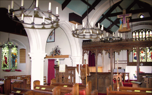 This photograph of the interior of Brundall church was taken in 2007.  You can see on the left of the picture,
the memorial window to those who fell in the First World War.  
