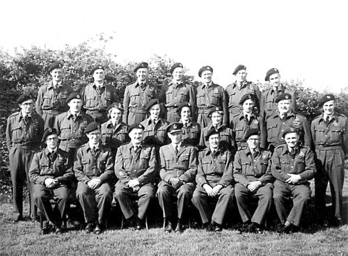 These are the members of the Royal Observer Corps, Brundall, 1939-45.
They manned the post which was in the field between the Mission and Links Avenue.
Their Post was a wooden box-like structure about ten feet square standing on iron legs
and open to the sky.  Full timers did eight hours on watch and part timers four hours.
Their aircraft recognition had to be of a very high standard in order to pass accurate information
to the Norwich Headquarters to be used by the RAF as well as the anti-aircraft gunners.
