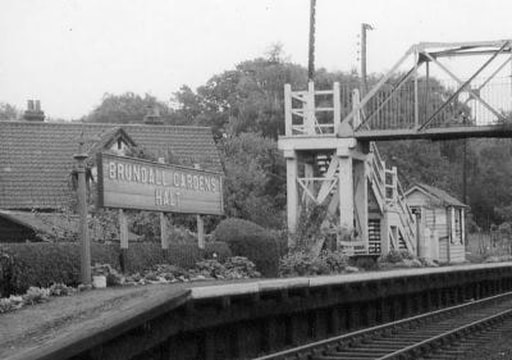 Brundall Gardens Halt pictured around 1960 and showing the old sign. Photo: ©Norfolk Railway Society CollectPicture